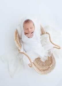 newborn in basket